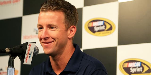WATKINS GLEN, NY - AUGUST 07: AJ Allmendinger, driver of the #47 Kroger/Bush's Beans Chevrolet, speaks to the media during a press conference prior to practice for the NASCAR Sprint Cup Series Cheez-It 355 at Watkins Glen International on August 7, 2015 in Watkins Glen, New York. (Photo by Daniel Shirey/Getty Images)