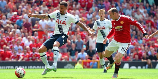 MANCHESTER, ENGLAND - AUGUST 08: Kyle Walker (L) of Tottenham Hotspur kicks the ball resulting in the own goal during the Barclays Premier League match between Manchester United and Tottenham Hotspur at Old Trafford on August 8, 2015 in Manchester, England. (Photo by Michael Regan/Getty Images)