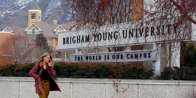 Feb. 17, 2012: A student walks past the entrance of Brigham Young University in Provo.