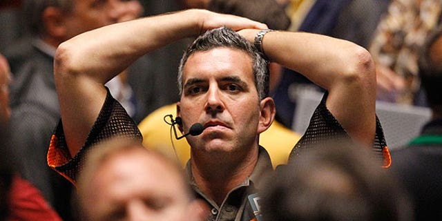 Aug. 8: Trader Patrick Garveyreacts after the close of trading in the S&amp;P 500 Futures pit, on the floor of The CME Group in Chicago.