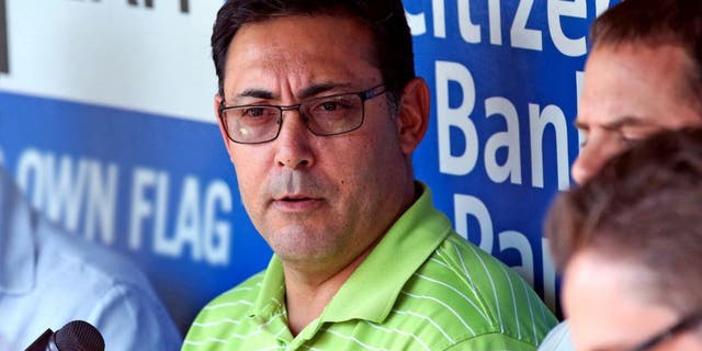 Jul 25, 2014; Philadelphia, PA, USA; Philadelphia Phillies general manager Ruben Amaro, Jr. talks with reporters during batting practice before a game against the Arizona Diamondbacks at Citizens Bank Park. Mandatory Credit: Bill Streicher-USA TODAY Sports