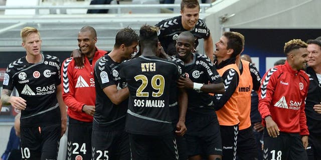 Reims' players celebrate after scoring a goal during the French L1 football match between Bordeaux and Reims at the new Stade in Bordeaux, southwestern France, on August 9, 2015. AFP PHOTO / JEAN PIERRE MULLER (Photo credit should read JEAN PIERRE MULLER/AFP/Getty Images)
