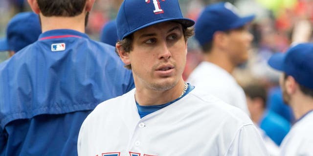 May 15, 2015; Arlington, TX, USA; Texas Rangers starting pitcher Derek Holland (45) before the game against the Cleveland Indians at Globe Life Park in Arlington. Mandatory Credit: Jerome Miron-USA TODAY Sports