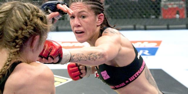 SUNRISE, FL - JANUARY 30: (R-L) Cristiane "Cyborg" Santos punches Marloes Coenen during the Women's Featherweight Championship bout at the Strikeforce Miami event on January 30, 2010 in Sunrise, Florida. (Photo by Esther Lin/Forza LLC/Forza LLC via Getty Images)