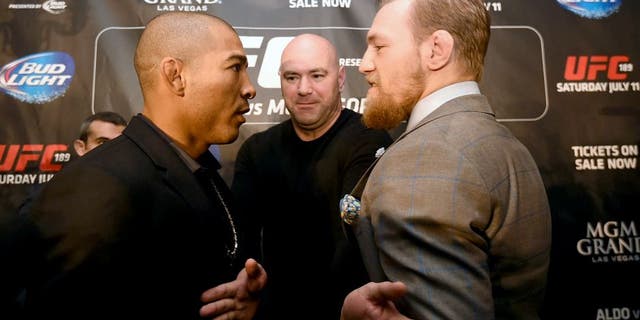 LONDON, ENGLAND - MARCH 30: UFC Featherweight Champion Jose Aldo (L) and UFC Featherweight Contender Conor McGregor (R) face off during the UFC 189 World Championship Press Tour on March 30, 2015 in London, England. (Photo by Tom Dulat/Zuffa LLC via Getty Images)