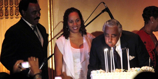 Aug. 11: Rep. Charles Rangel blows out his candles while onstage with his daughter Alicia Rangel, center, and singer Chuck Jackson during his birthday fundraiser at the Plaza Hotel in New York.