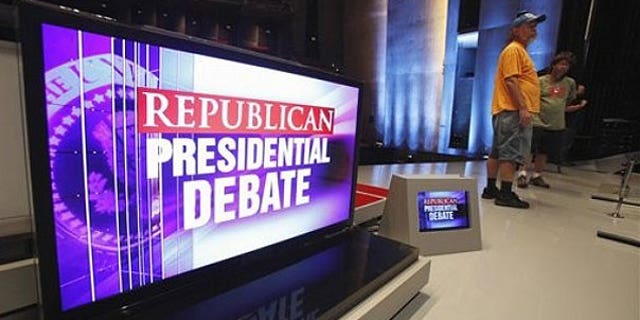 August 10: Workers are seen on stage at CY Stephens Auditorium in Ames, Iowa, during setup up for Thursday's Iowa GOP/Fox News Debate.