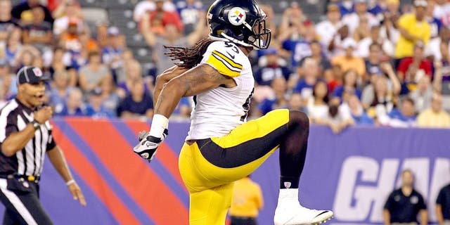 Aug 9, 2014; East Rutherford, NJ, USA; Pittsburgh Steelers outside linebacker Jarvis Jones (95) celebrates after sacking New York Giants quarterback Eli Manning (10) during the first quarter at MetLife Stadium. Mandatory Credit: Adam Hunger-USA TODAY Sports