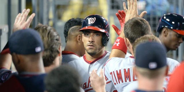 Aug 10, 2015; Los Angeles, CA, USA; Washington Nationals shortstop Ian Desmond (20) celebrates scoring against the Los Angeles Dodgers during the eighth inning at Dodger Stadium. Mandatory Credit: Richard Mackson-USA TODAY Sports