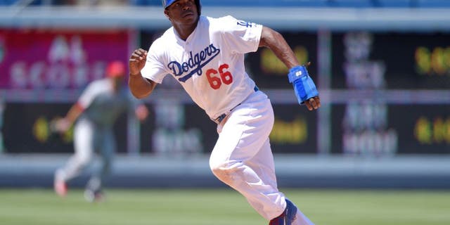 LOS ANGELES, CA - AUGUST 1: Yasiel Puig #66 of the Los Angeles Dodgers runs during the game against the Los Angeles Angels of Anaheim at Dodger Stadium on August 1, 2015 in Los Angeles, California. (Photo by Matt Brown/Angels Baseball LP/Getty Images)