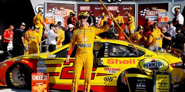 WATKINS GLEN, NY - AUGUST 09: Joey Logano, driver of the #22 Shell Pennzoil Ford, celebrates in victory lane after winning the NASCAR Sprint Cup Series Cheez-It 355 at the Glen at Watkins Glen International on August 9, 2015 in Watkins Glen, New York. (Photo by Robert Laberge/NASCAR via Getty Images)