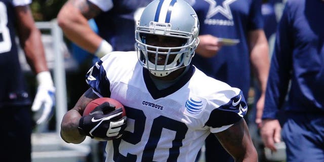 May 27, 2015; Dallas, TX, USA; Dallas Cowboys running back Darren McFadden (20) runs with the ball during OTAs at Dallas Cowboys Headquarters. Mandatory Credit: Matthew Emmons-USA TODAY Sports