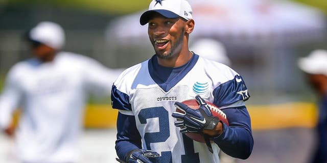 Dallas Cowboys running back Joseph Randle reacts after running an play during NFL football training camp, Friday, July 31, 2015, in Oxnard, Calif. (AP Photo/Gus Ruelas)