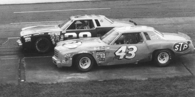 MARTINSVILLE, VA - 1979: Richard Petty (No. 43) working underneath Buddy Baker at Martinsville. (Photo by ISC Archives via Getty Images)