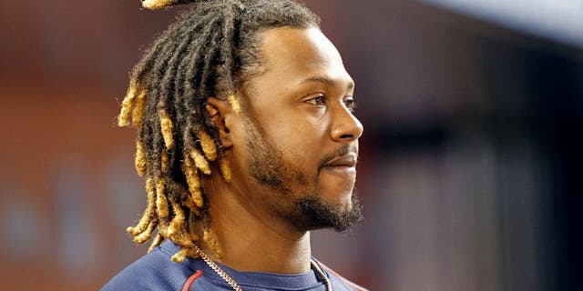MIAMI, FL - AUGUST 11: Hanley Ramirez #13 of the Boston Red Sox stands in the dugout as the Red Sox played the Miami Marlins at Marlins Park on August 11, 2015 in Miami, Florida. (Photo by Joe Skipper/Getty Images)