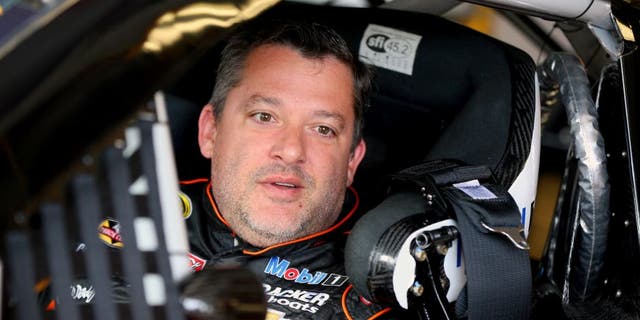 WATKINS GLEN, NY - AUGUST 07: Tony Stewart, driver of the #14 Bass Pro Shops/Mobil 1 Chevrolet, sits in his car in the garage area during practice for the NASCAR Sprint Cup Series Cheez-It 355 at Watkins Glen International on August 7, 2015 in Watkins Glen, New York. (Photo by Matt Sullivan/Getty Images)