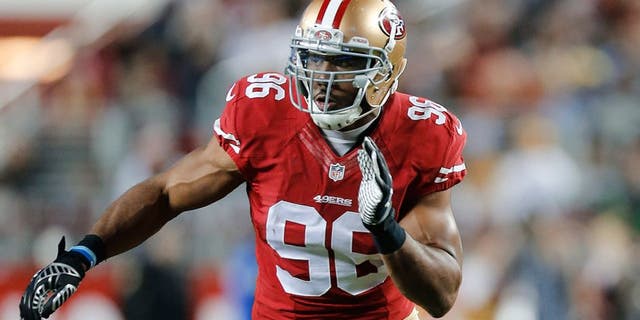 SANTA CLARA, CA - DECEMBER 20: Corey Lemonier #96 of the San Francisco 49ers rushes the passer during the game against the San Diego Chargers at Levi Stadium on December 20, 2014 in Santa Clara, California. The Chargers defeated the 49ers 38-35 in overtime. (Photo by Michael Zagaris/San Francisco 49ers/Getty Images)