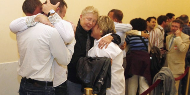 Aug. 12: Same-sex couples waiting in line to be married react to the news that they may not marry for at least another week in San Francisco.