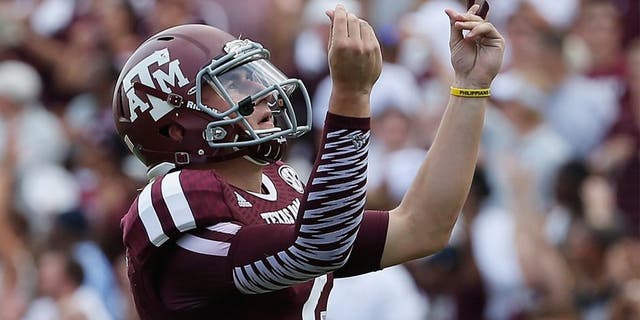 COLLEGE STATION, TX - AUGUST 31: Johnny Manziel #2 of the Texas A&M Aggies celebrates a third quarter touchdown during the game against the Rice Owls at Kyle Field on August 31, 2013 in College Station, Texas. (Photo by Scott Halleran/Getty Images)
