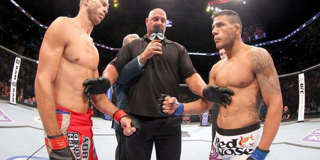 INDIANAPOLIS, IN - AUGUST 28: (L-R) Opponents Donald "Cowboy" Cerrone and Rafael dos Anjos face off before their lightweight fight during the UFC on FOX Sports 1 event at Bankers Life Fieldhouse on August 28, 2013 in Indianapolis, Indiana. (Photo by Ed Mulholland/Zuffa LLC/Zuffa LLC via Getty Images)