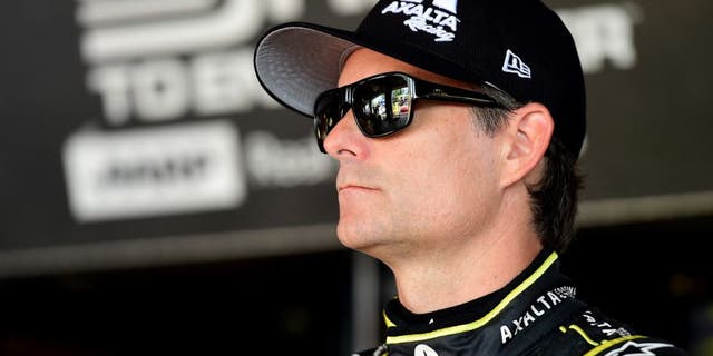 WATKINS GLEN, NY - AUGUST 07: Jeff Gordon, driver of the #24 Axalta Chevrolet, stands in the garage area during practice for the NASCAR Sprint Cup Series Cheez-It 355 at Watkins Glen International on August 7, 2015 in Watkins Glen, New York. (Photo by Jared C. Tilton/NASCAR via Getty Images)