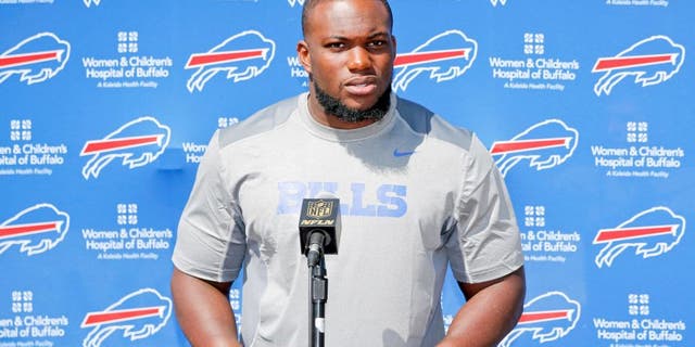 Buffalo Bills' IK Enemkpali, released this week by the New York Jets, speaks to the media at NFL football training camp, Thursday, Aug. 13, 2015, in Pittsford, N.Y. The Bills claimed the second-year player off of waivers on Wednesday, a day after he was released by the Jets because he hit quarterback Geno Smith with a sucker punch, breaking his jaw. (AP Photo/Mike Groll)