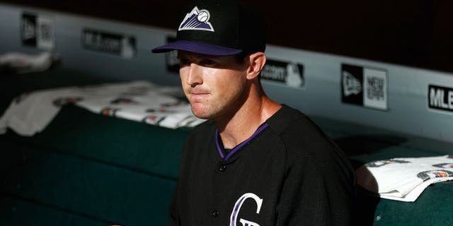 PHOENIX, AZ - JULY 03: Drew Stubbs #13 of the Colorado Rockies sits in the dugout before the MLB game against the Arizona Diamondbacks at Chase Field on July 3, 2015 in Phoenix, Arizona. (Photo by Christian Petersen/Getty Images)