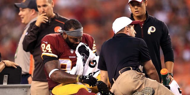 Aug 13, 2015; Cleveland, OH, USA; Washington Redskins tight end Niles Paul (84) is carted off the field after an injury during the first quarter of preseason NFL football game against the Cleveland Browns at FirstEnergy Stadium. Mandatory Credit: Andrew Weber-USA TODAY Sports