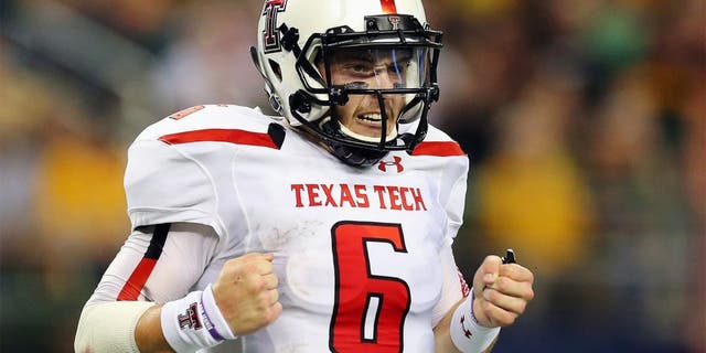ARLINGTON, TX - NOVEMBER 16: Baker Mayfield #6 of the Texas Tech Red Raiders celebrates his second touchdown pass against the Baylor Bears at AT&T Stadium on November 16, 2013 in Arlington, Texas. (Photo by Ronald Martinez/Getty Images)