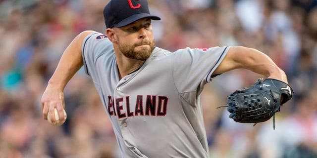 Aug 14, 2015; Minneapolis, MN, USA; Cleveland Indians starting pitcher Corey Kluber (28) delivers a pitch in the first inning against the Minnesota Twins at Target Field. Mandatory Credit: Jesse Johnson-USA TODAY Sports