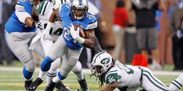 Aug 13, 2015; Detroit, MI, USA; Detroit Lions running back Ameer Abdullah (21) evades a tackle from New York Jets free safety Calvin Pryor (25) during the first quarter of a preseason NFL football game at Ford Field. Mandatory Credit: Raj Mehta-USA TODAY Sports