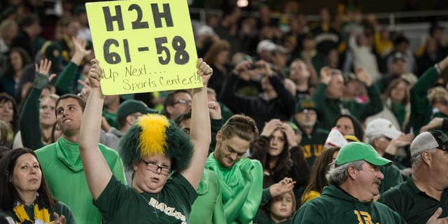 Dec 6, 2014; Waco, TX, USA; A Baylor Bears fan holds up a sign with the October score of the Bears game against the TCU Horned Frogs during the second half of the game between the Bears and the Kansas State Wildcats at McLane Stadium. The Bears defeated the Wildcats 38-27. Mandatory Credit: Jerome Miron-USA TODAY Sports
