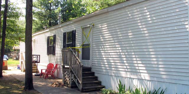 Aug. 14, 2015: Photo shows the mobile home where a couple and their two young children were found dead in Grand Traverse County’s Garfield Township, Michigan, according to authorities.