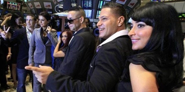 July 27: Cast members of MTV's "Jersey Shore" reality series pose for photos after ringing the opening bell of the New York Stock Exchange. They are, from left: Vinny Guadagnino; Jenni "J-Woww" Farley; Nicole "Snooki" Polizzi; Michael "The Situation" Sorrentino; Ronnie Ortiz; Angelina "Jolie" Pivarnick. (AP Photo/Richard Drew)