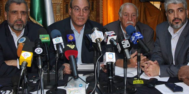 Aug. 15: Eleven Damascus-based opposition Palestinian groups gather in Damascus, Syria, to agree on a united stance towards direct negotiations between Israel and the Palestinian Authority, with from the right, Khaled Mashaal, head of Hamas politburo; Ahmed Jibril, the Popular Front for the Liberation of Palestine General Command; Maher Taher, the Popular Front for the Liberation of Palestine's representative in Damascus; and Ramadan Shallah, the secretary general of the Islamic Jihad leader.