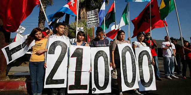 Aug. 15: Immigrant rights groups and community members rally in Los Angeles for an end to the Department of Homeland Security's (DHS) Secure Communities Program, which was created in 2008 and calls for police to submit suspects' fingerprints to DHS so they can be cross-checked with federal deportation orders.