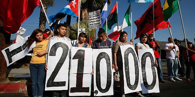 Aug. 15: Immigrant rights groups and community members rally in Los Angeles for an end to the Department of Homeland Security's (DHS) Secure Communities Program, which was created in 2008 and calls for police to submit suspects' fingerprints to DHS so they can be cross-checked with federal deportation orders.