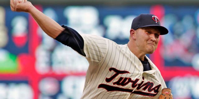 Minnesota Twins starting pitcher Tyler Duffey delivers during the sixth inning of a baseball game against the Cleveland Indians on Saturday, Aug. 15, 2015, in Minneapolis. Duffey picked up his first major league win, giving up one hit in six innings, as Minnesota won 4-1. AP Photo/Paul Battaglia)