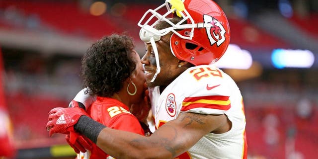 Aug 15, 2015; Glendale, AZ, USA; Kansas City Chiefs defensive back Eric Berry (29) hugs his mother Carol Berry prior to the game against the Arizona Cardinals in a preseason NFL football game at University of Phoenix Stadium. Mandatory Credit: Mark J. Rebilas-USA TODAY Sports