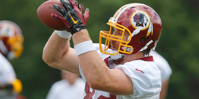 Jun 16, 2015; Ashburn, VA, USA; Washington Redskins tight end Logan Paulsen (82) catches the ball during day one of Redskins Minicamp at Redskins Park. Mandatory Credit: Geoff Burke-USA TODAY Sports