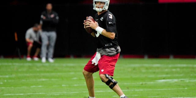 Aug 1, 2015; Glendale, AZ, USA; Arizona Cardinals quarterback Carson Palmer (3) throws during training camp at University of Phoenix. Mandatory Credit: Matt Kartozian-USA TODAY Sports