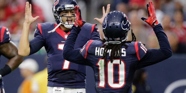 Houston Texans' Brian Hoyer (7) and DeAndre Hopkins (10) celebrate a two-point conversion against the San Francisco 49ers during the first quarter of an NFL preseason football game, Saturday, Aug. 15, 2015, in Houston. (AP Photo/Patric Schneider)