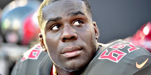 Dec 14, 2014; Charlotte, NC, USA; Tampa Bay Buccaneers tackle Demar Dotson (69) on the sidelines in the fourth quarter. The Panthers defeated the Buccaneers 19-17 at Bank of America Stadium. Mandatory Credit: Bob Donnan-USA TODAY Sports