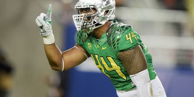 Dec 5, 2014; Santa Clara, CA, USA; Oregon Ducks defensive end DeForest Buckner (44) celebrates after a sack in the second quarter against the Arizona Wildcats in the Pac-12 Championship at Levi's Stadium. Mandatory Credit: Kirby Lee-USA TODAY Sports