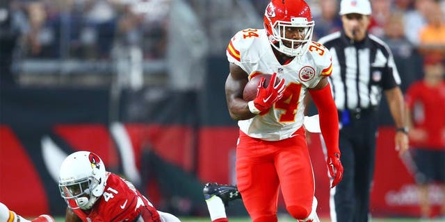 Aug 15, 2015; Glendale, AZ, USA; Kansas City Chiefs running back Knile Davis (34) runs the ball against the Arizona Cardinals in a preseason NFL football game at University of Phoenix Stadium. Mandatory Credit: Mark J. Rebilas-USA TODAY Sports