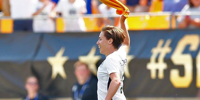 PITTSBURGH, PA - AUGUST 16: Meghan Klingenberg #22 of the United States celebrates her goal in the second half by waving the Terrible Towel against Costa Rica during the match at Heinz Field on August 16, 2015 in Pittsburgh, Pennsylvania. (Photo by Jared Wickerham/Getty Images)