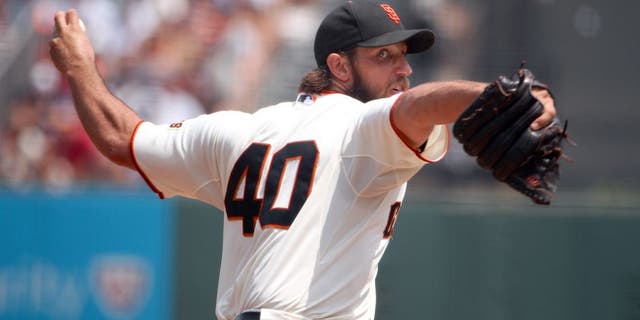 SAN FRANCISCO, CA - AUGUST 16: Madison Bumgarner #40 of the San Francisco Giants pitches against the Washington Nationals in the third inning at AT&T Park on August 16, 2015 in San Francisco, California. (Photo by Ezra Shaw/Getty Images)