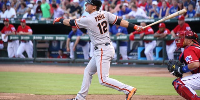 ARLINGTON, TX - AUGUST 1: Bobby Wilson #8 of the Texas Rangers looks on as Joe Panik #12 of the San Francisco Giants hits a double RBI the third inning at Globe Life Park in Arlington on August 1, 2015 in Arlington, Texas. (Photo by Rick Yeatts/Getty Images)