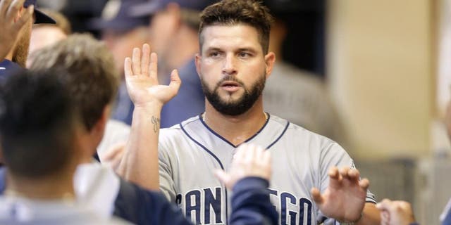 MILWAUKEE, WI - AUGUST 05: Yonder Alonso #23 of the San Diego Padres celebrates after reach home plate on a RBI single hit by Will Venable in the seventh inning against the Milwaukee Brewers at Miller Park on August 05, 2015 in Milwaukee, Wisconsin. (Photo by Mike McGinnis/Getty Images)