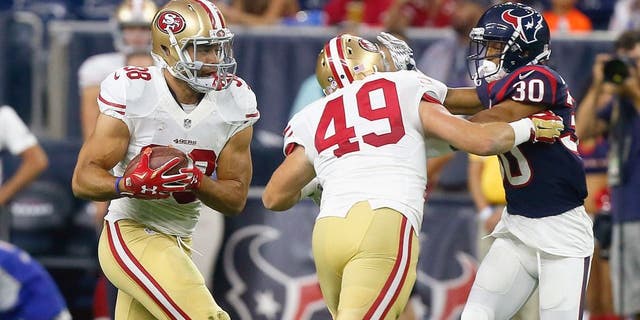 HOUSTON, TX - AUGUST 15: Jarryd Hayne #38 of the San Francisco 49ers rushes with the ball as he gets a block from Bruce Miller #49 on Kevin Johnson #30 of the Houston Texans during a preseason football game at NRG Stadium on August 15, 2015 in Houston, Texas. Houston won 23-10. (Photo by Bob Levey/Getty Images)